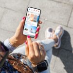 A woman looking at social media on her phone.