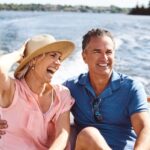 A couple on a yacht cruise.