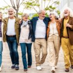 A group of people walking together and laughing.