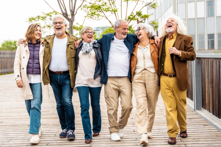 A group of people walking together and laughing.