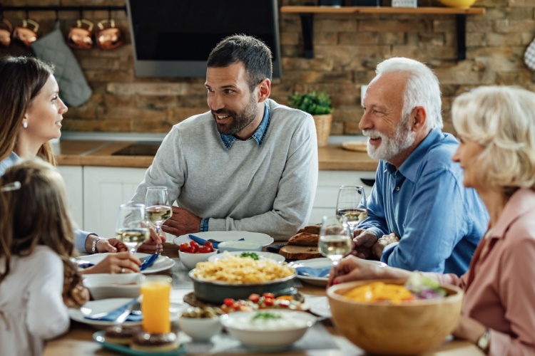 Multiple generations enjoying a family dinner.