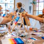 A group of people attending a painting workshop.