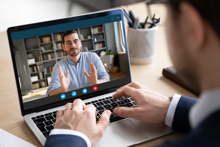 Someone using Zoom to talk to a person.