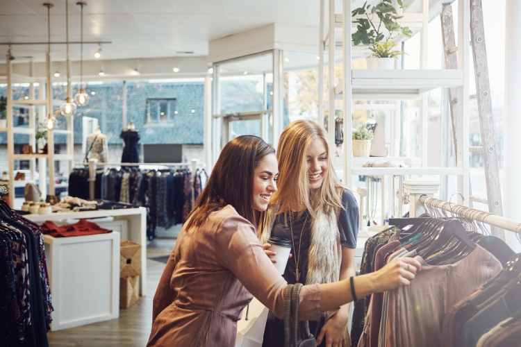 Two women clothes shopping.