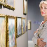 A woman looking at art in a gallery.