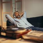 A man relaxing while listening to music.