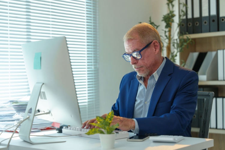 A man working at an office desk.