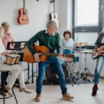 A group of people in their 50s playing musical instruments in a band.
