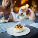 A couple enjoying a meal in a restaurant.