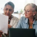 A couple reviewing paperwork together.