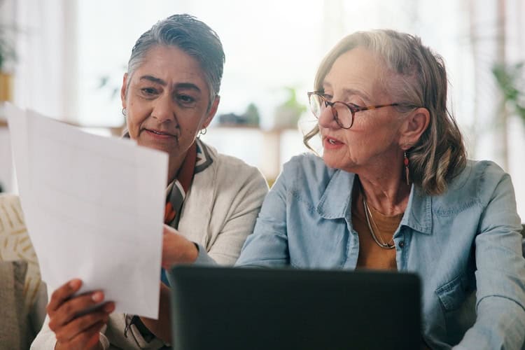 A couple reviewing paperwork together.