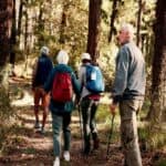 Group of older adults hiking in the forest